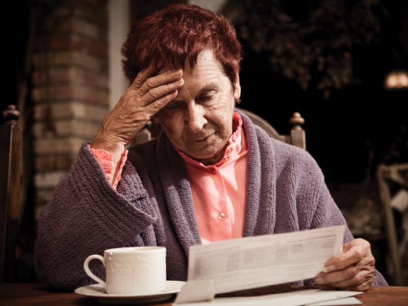Older woman with bills