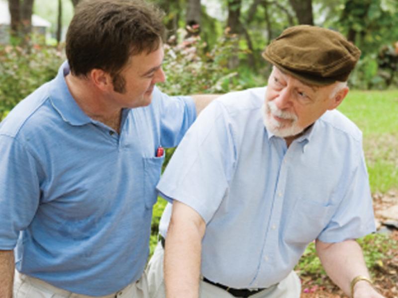 Man helping older person